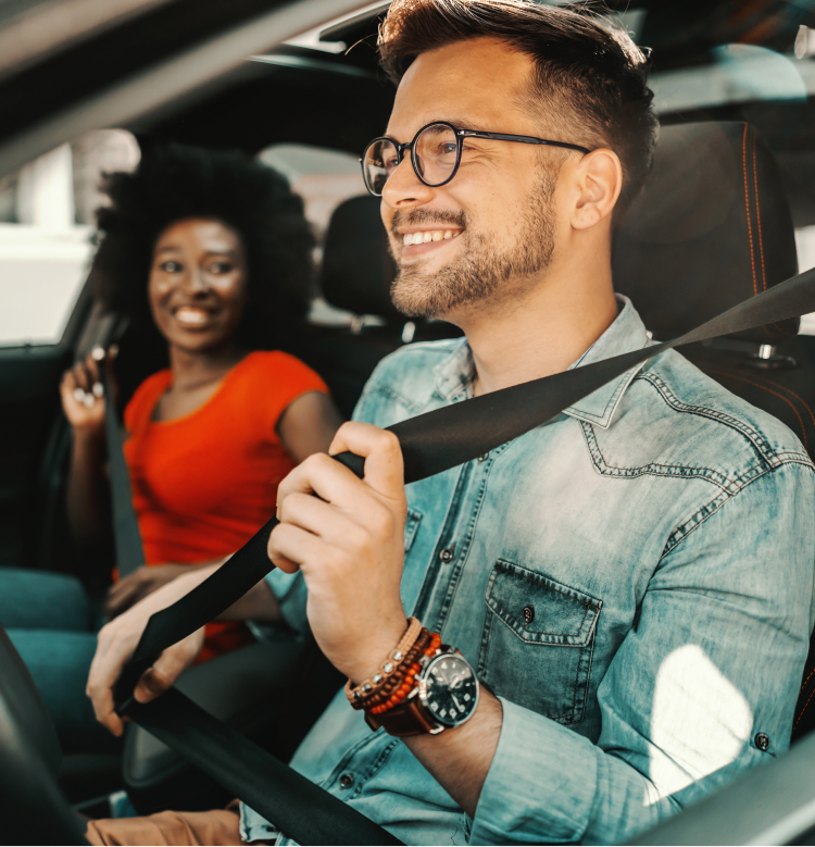 Couple in vehicle wearing seatbelts