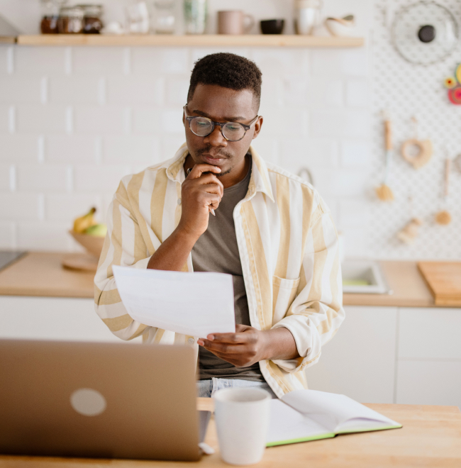 Man thinking in front of his laptop
