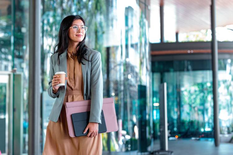 woman with books and coffee